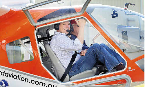 Ergon Chairman Ralph Craven is all smiles after a test flight in Hervey Bay. Ergon Chairman Ralph Craven is all smiles after a test flight in Hervey Bay.